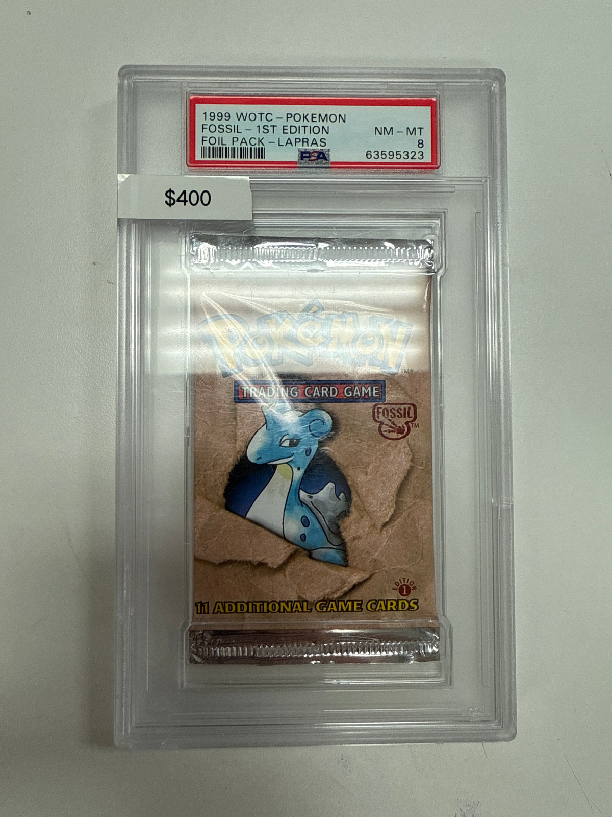 Pokémon Fossil 1st Ed. Booster Pack PSA 8